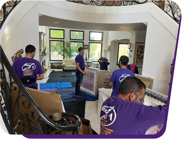 Movers carrying a box